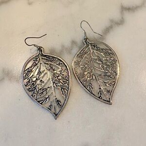 Intricate leaf oversized earrings, silver colour